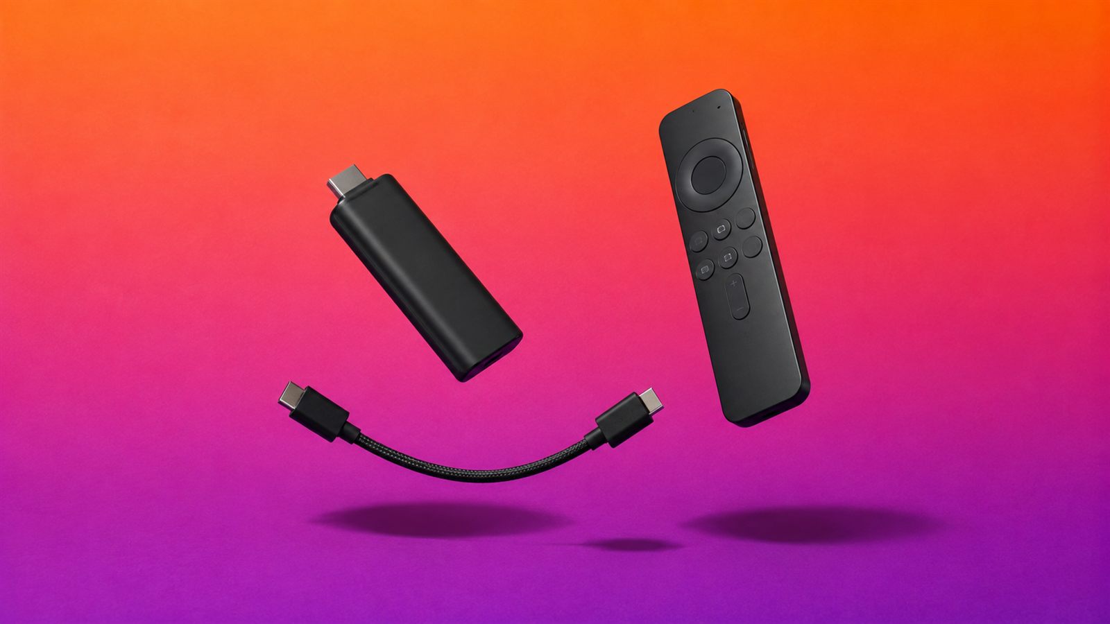 A black Fire TV streaming stick and its remote lit by the warm glow of a television in a dark room