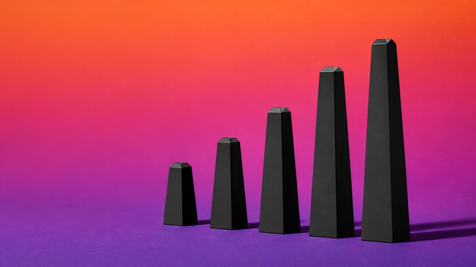 A row of matte-black milestone markers rising in height across a saturated orange and violet backdrop